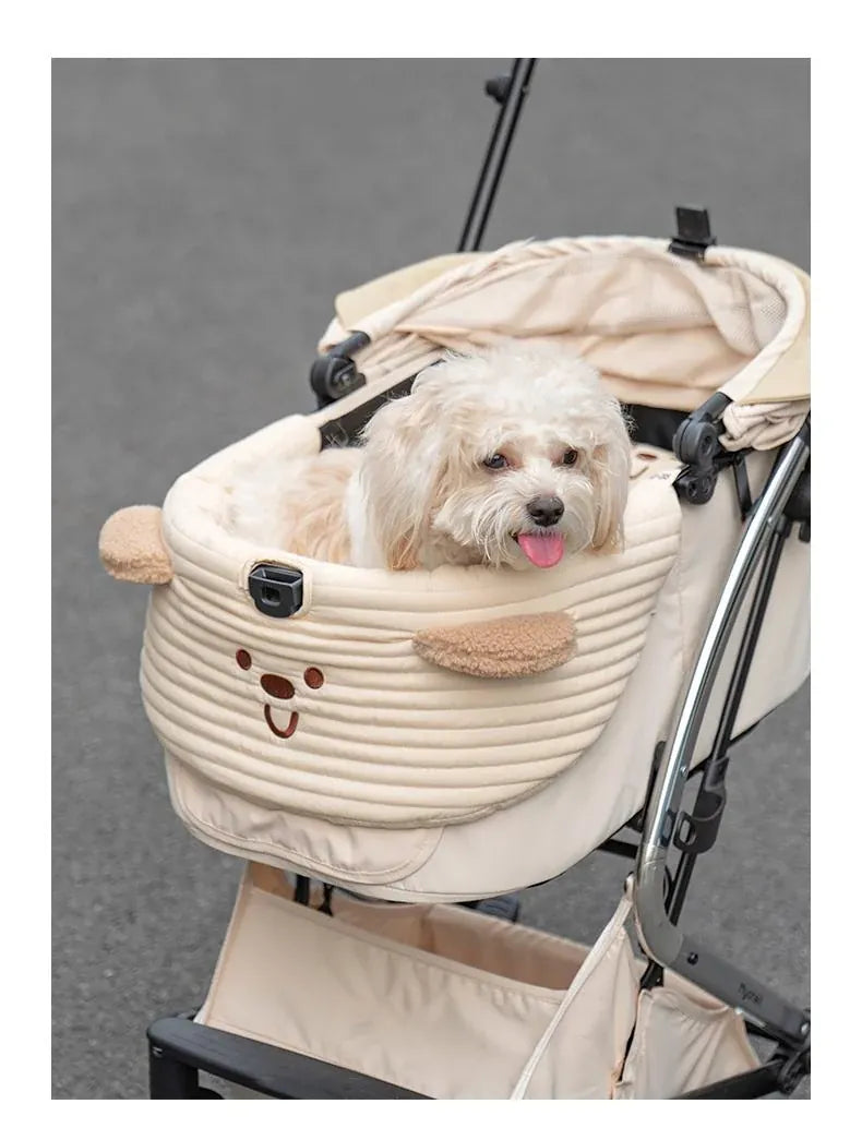 Small dog riding in a DearPet stroller liner